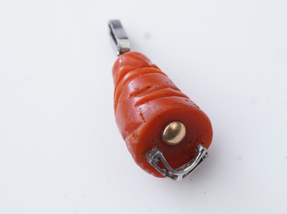 An Art Deco carved coral and diamond pendant, 1920s